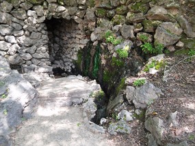 A small hot spring coming up near the plaza