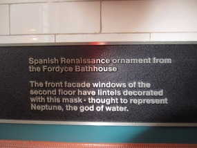 Plaque describing the ornamental head of Neptune