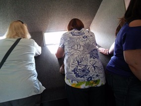 Sharon looking out the window, taking pictures.
