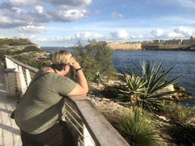 Wistfully gazing across the water