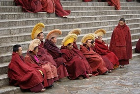 Monks Resting on Steps of Temple