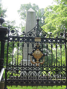 Gravesite Surrounded By Fence and Gate