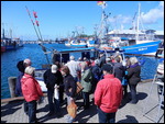 Crowds around the only fish seller.  