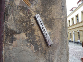 Surviving mezuzah on Orthodox Jewish doorpost