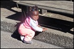 Isn't she so cute, playing near Mum's stall