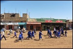 School children beautifully dressed in the dirt