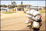 Bags of charcoal on a bike