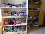 Clothes in tidy piles at the orphanage
