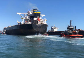 Tugs doing the turn-around of the ship