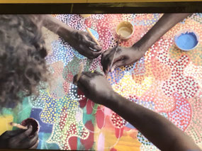 Many hands painting