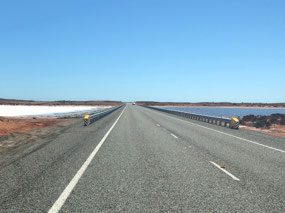 Causeway across salt pan and pond