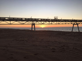 Sunset through the salt jetty