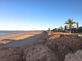 Tide out below the foreshore walkway