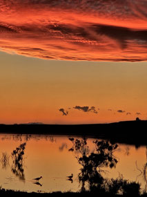 Sunset clouds over the desert lake