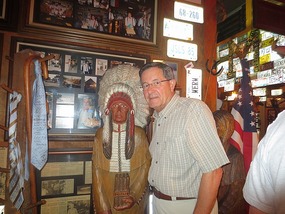 John and a wooden Indian at Lambert's Cafe