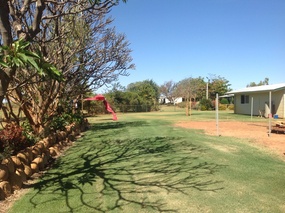 Staff grounds with Nick's place in the background 