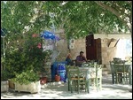 Locals sitting at the Restaurant of the village