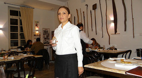 The lady welcomes each guest with some rose water 