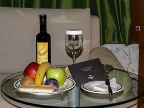 A bottle of wine and fruit -Complimentary treat