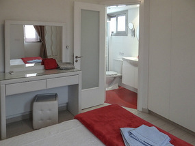 Interior of the bedroom and corner bathroom