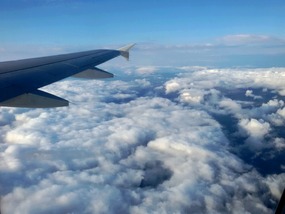 High above the clouds...I can't wait to land.