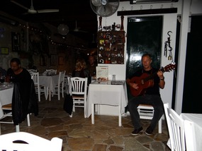 Michali Pourgourides performing with his guitar