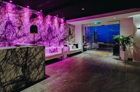 The lobby with lights on, at night