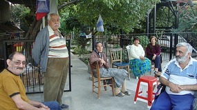 Neighbours gathered at the side of the street