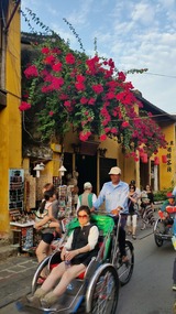 Stunning bougainvillea  with cyclo driver 