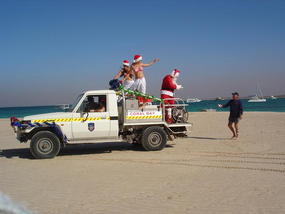 Santa Leaves The Beach.