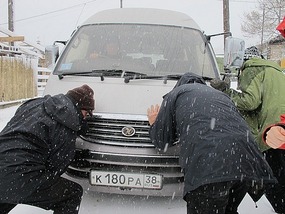 Pushing The Van Out Of The Snow. 