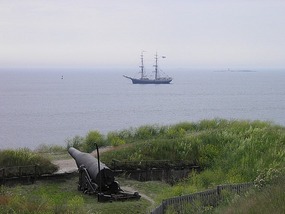 Ship Sailing Passed Suomenlinna Cannon. 