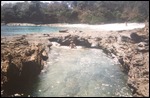 Buck Naked Beach beyond the rocks  