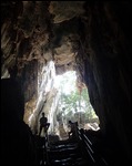 Cave guides sit by entranceway