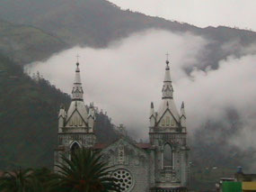 A cloud rolls in behind the church