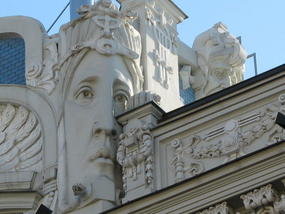 Heads atop a building