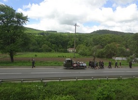 Funeral procession on a bright sunny day