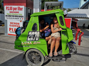 A tricycle is a motorcyle with a built on cab