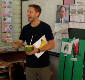 Trying to teach while holding a coconut