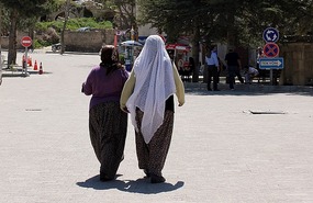 Baggy pants and white headscarves