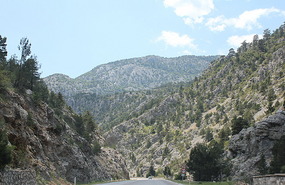 Mountains tower above car