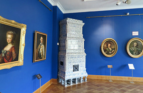 Every room has blue and white tiled fireplace