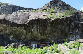 Houses under rock