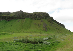 High mountains on one side of road