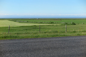 Other side of road is flat to the sea