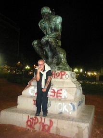 A copy of Rodin's thinker with real thinker 4.30am