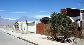 Our hostel (brown building) & view of the Andes