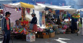 Market stalls selling carnaval stuff Uyuni