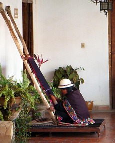 Woman weaving at the museum