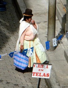 Woman contemplating which fabric to buy